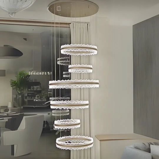 Zawieszany żyrandol LED z pilotem NIVALIS Grand 480W, światło zimne/ciepłe/neutralne, możliwość przyciemniania, regulacja wysokości, złote nowoczesne żyrandole Tytuł domyślny Alessandro Design