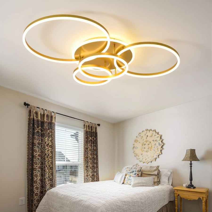 Żyrandol LED z pilotem DARIO, 4 okręgi, 103 W, światło ciepłe/zimne/neutralne, ściemnialny, złoty